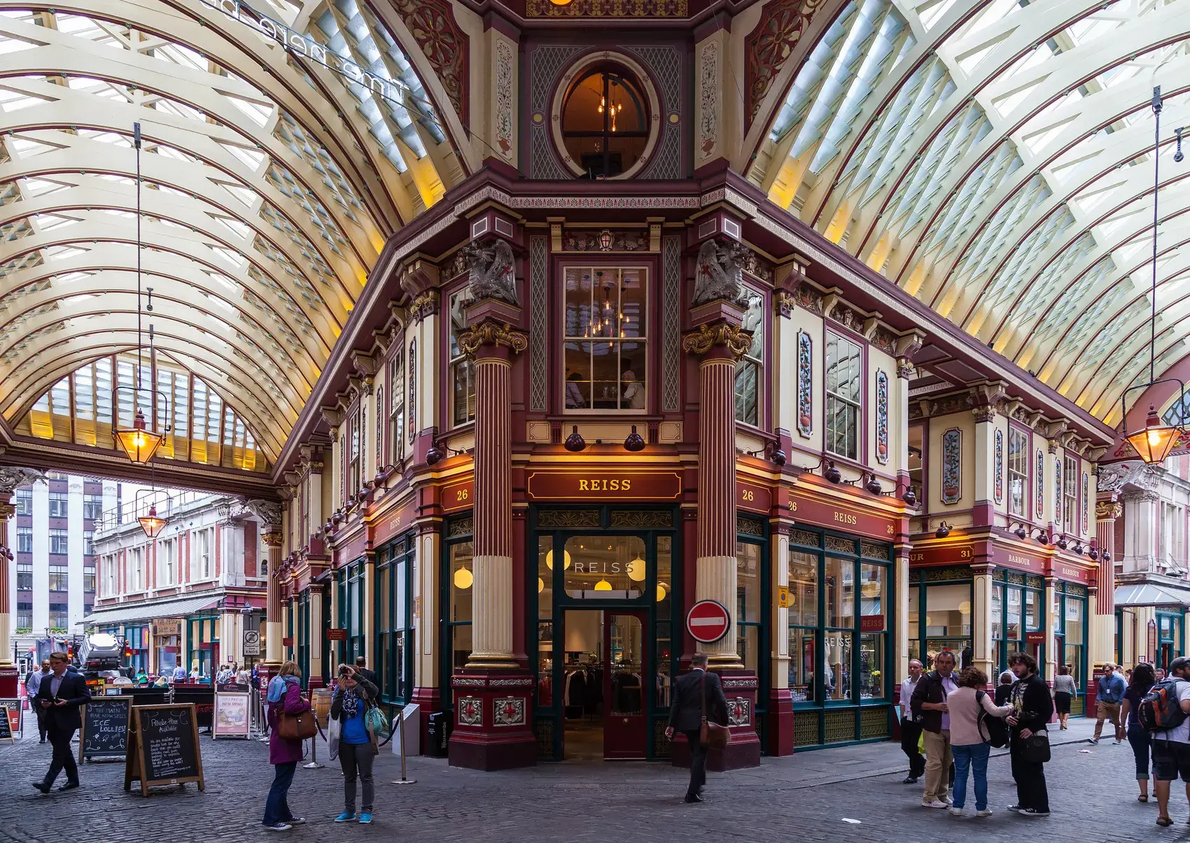 Shops and cafes under the glass roof of Leadenhall Market in the City of London